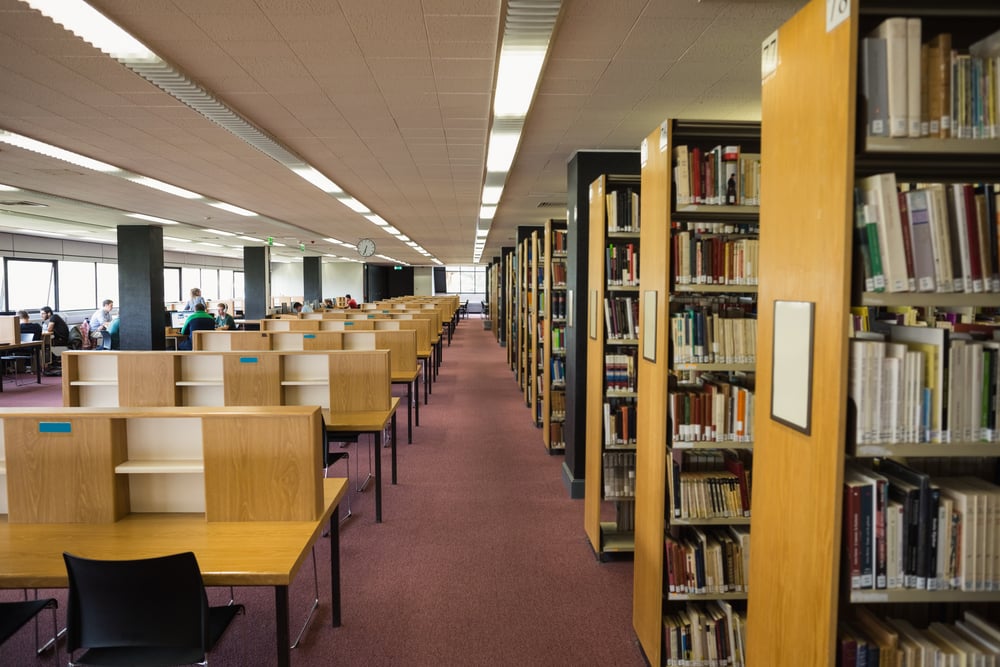 Volumes of books on bookshelf in library at the university